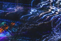 An abstract animation of swirling musical notes blending with colorful lights.