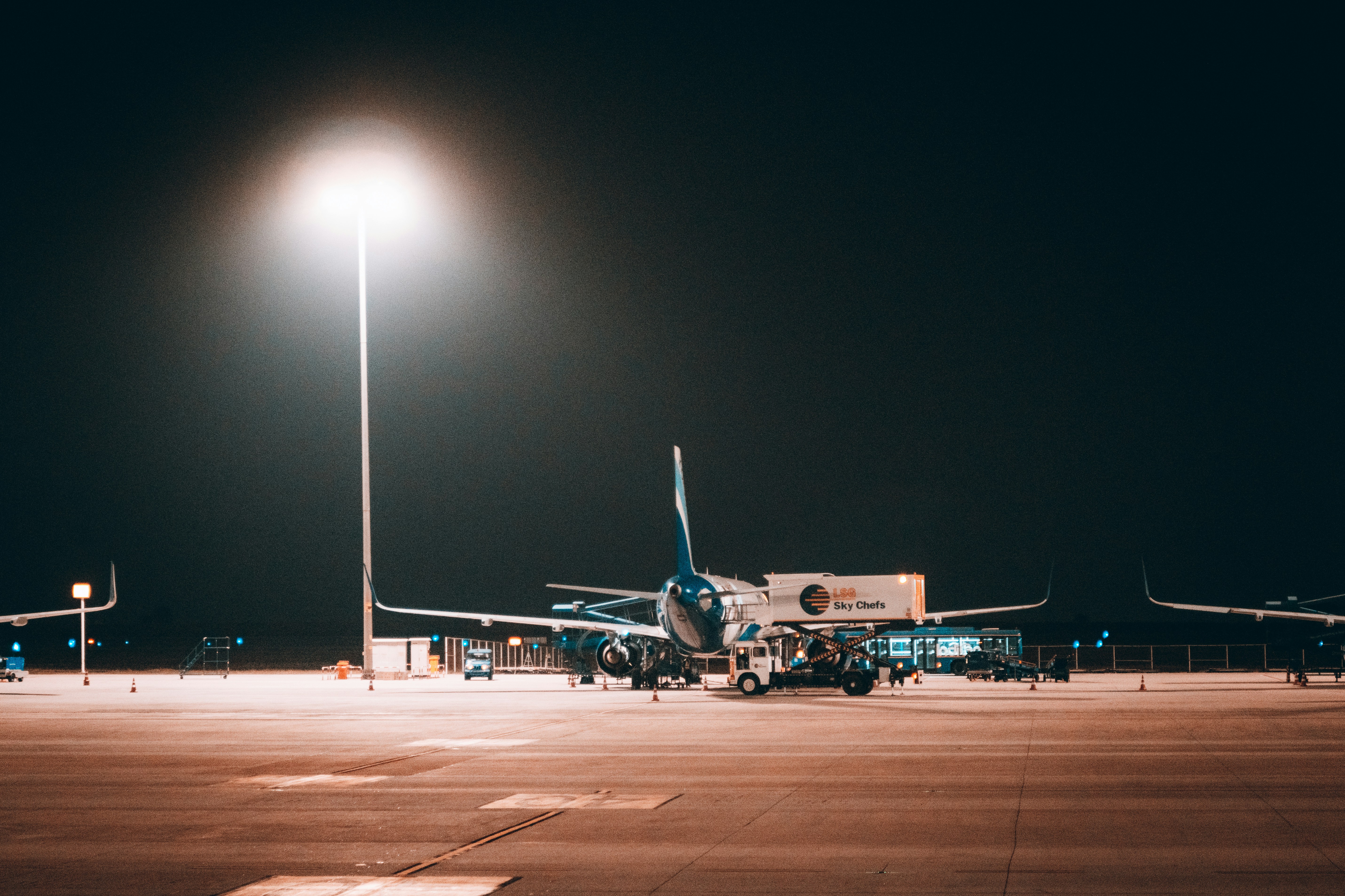 a large jetliner sitting on top of an airport tarmac