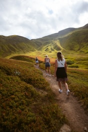 A group of people enjoying a guided countryside excursion under a sunny sky.