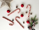 a white table topped with candy canes and christmas decorations
