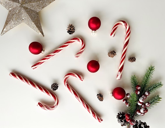 a white table topped with candy canes and christmas decorations