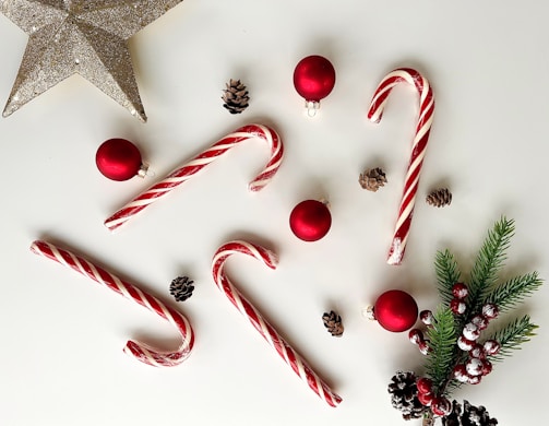 a white table topped with candy canes and christmas decorations