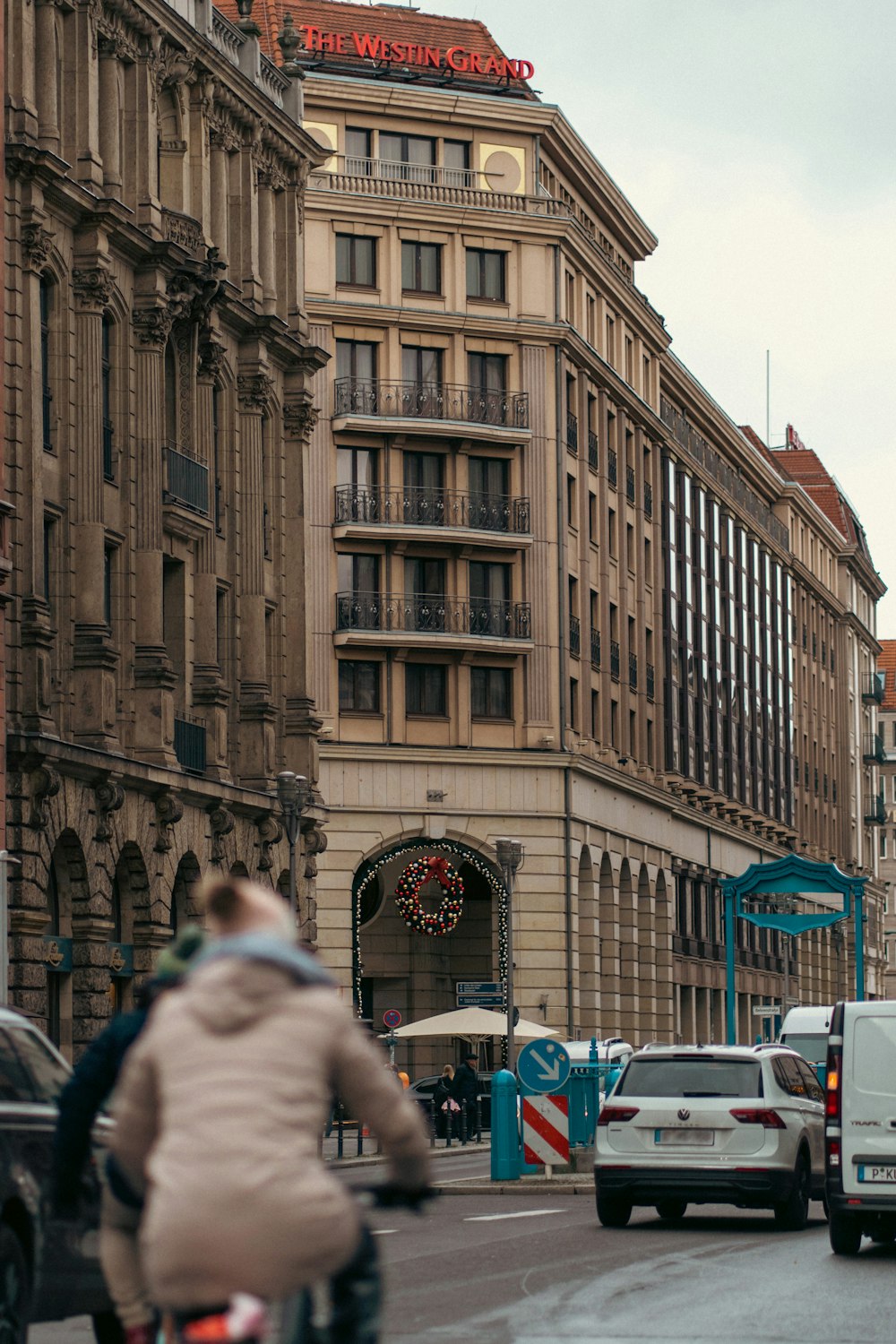 a person riding a bike on a city street