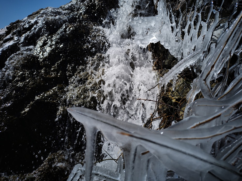 a close up of ice and water on a mountain