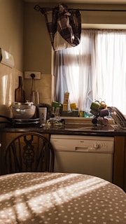 Close-up of easy-clean kitchen tiers with subtle patterns, brightening a sunny breakfast nook.