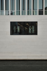 A completed commercial shop building made with prefabricated concrete panels.