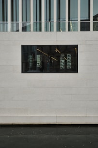 A completed commercial shop building made with prefabricated concrete panels.