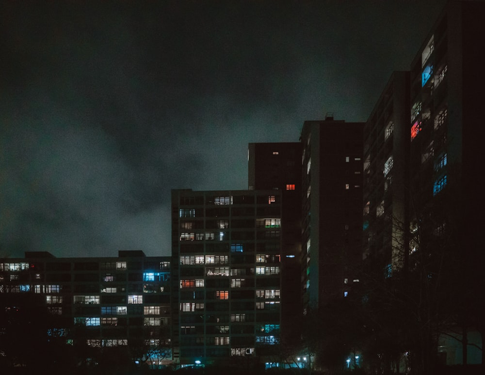 a city at night with a lot of windows lit up