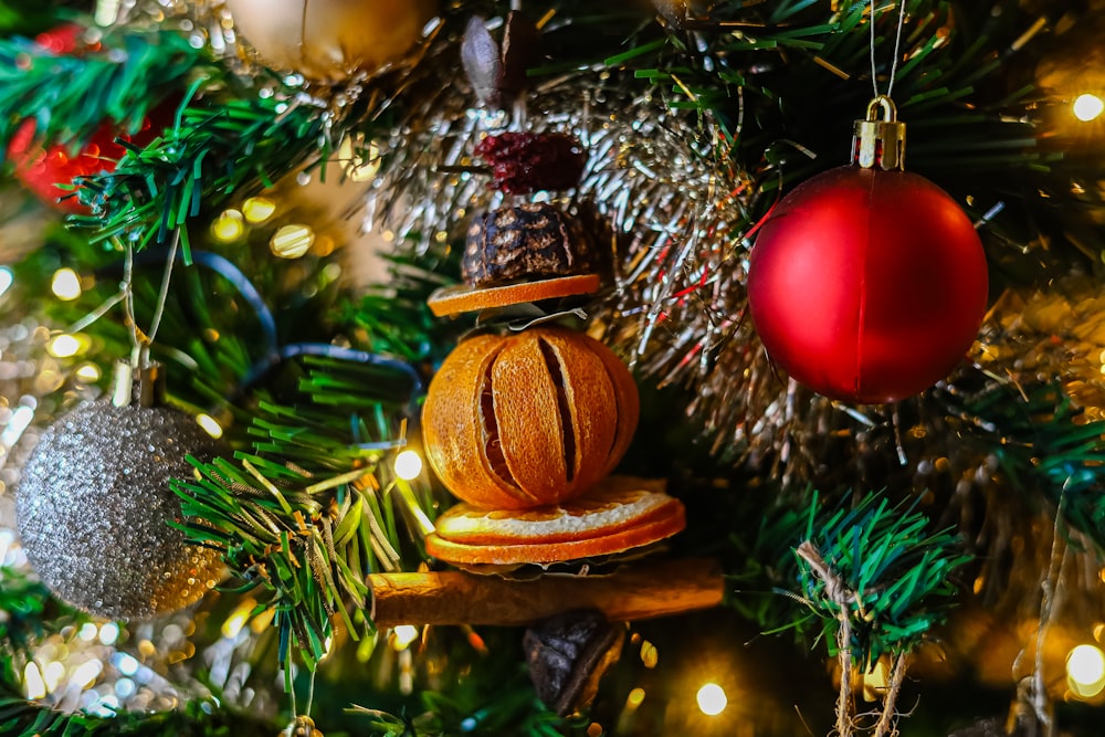 a close up of a christmas tree with ornaments