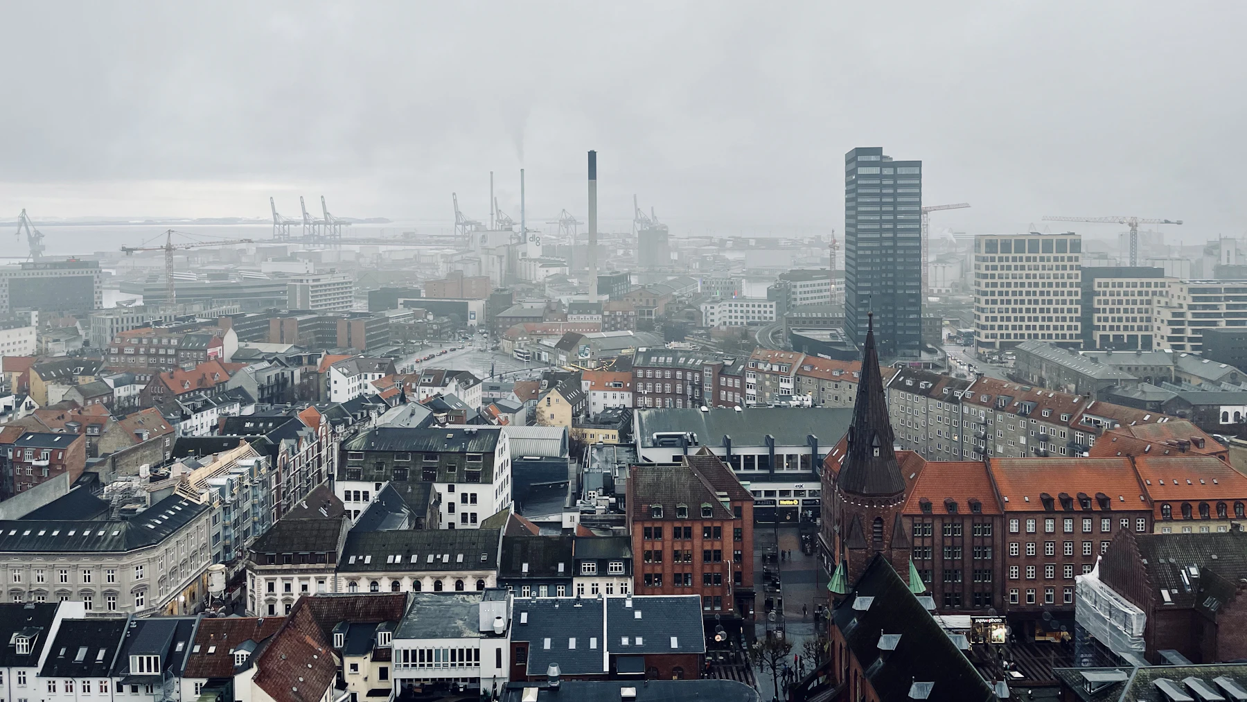 Aarhus rooftops and central buildings viewed from above.
