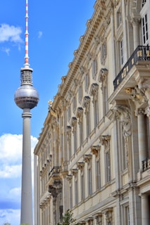 a tall building with a red and white flag on top of it