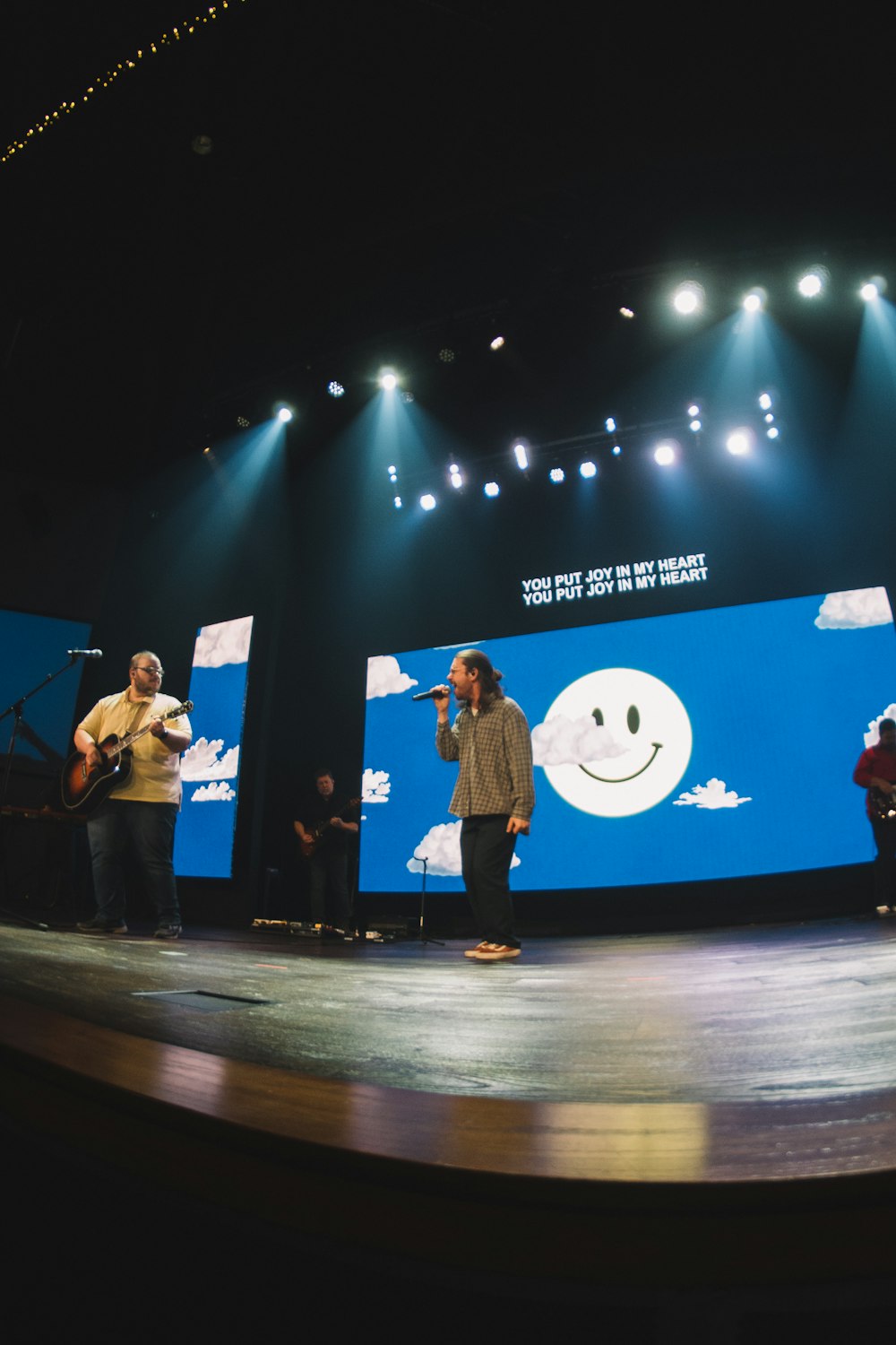 a group of people standing on top of a stage