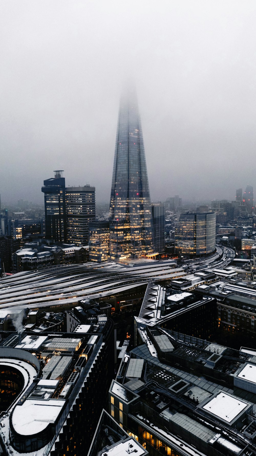 a very tall building towering over a city