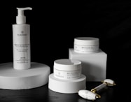 Sleek, clinical skincare containers arranged to highlight the Age protocol.