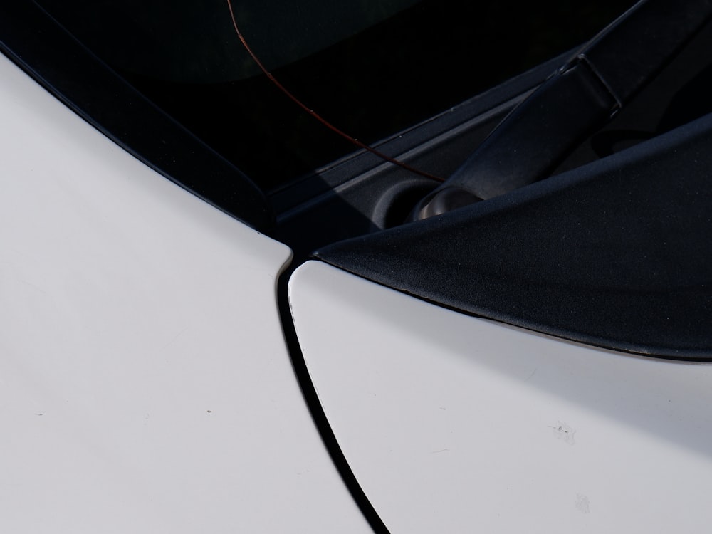 a close up of the side of a white car