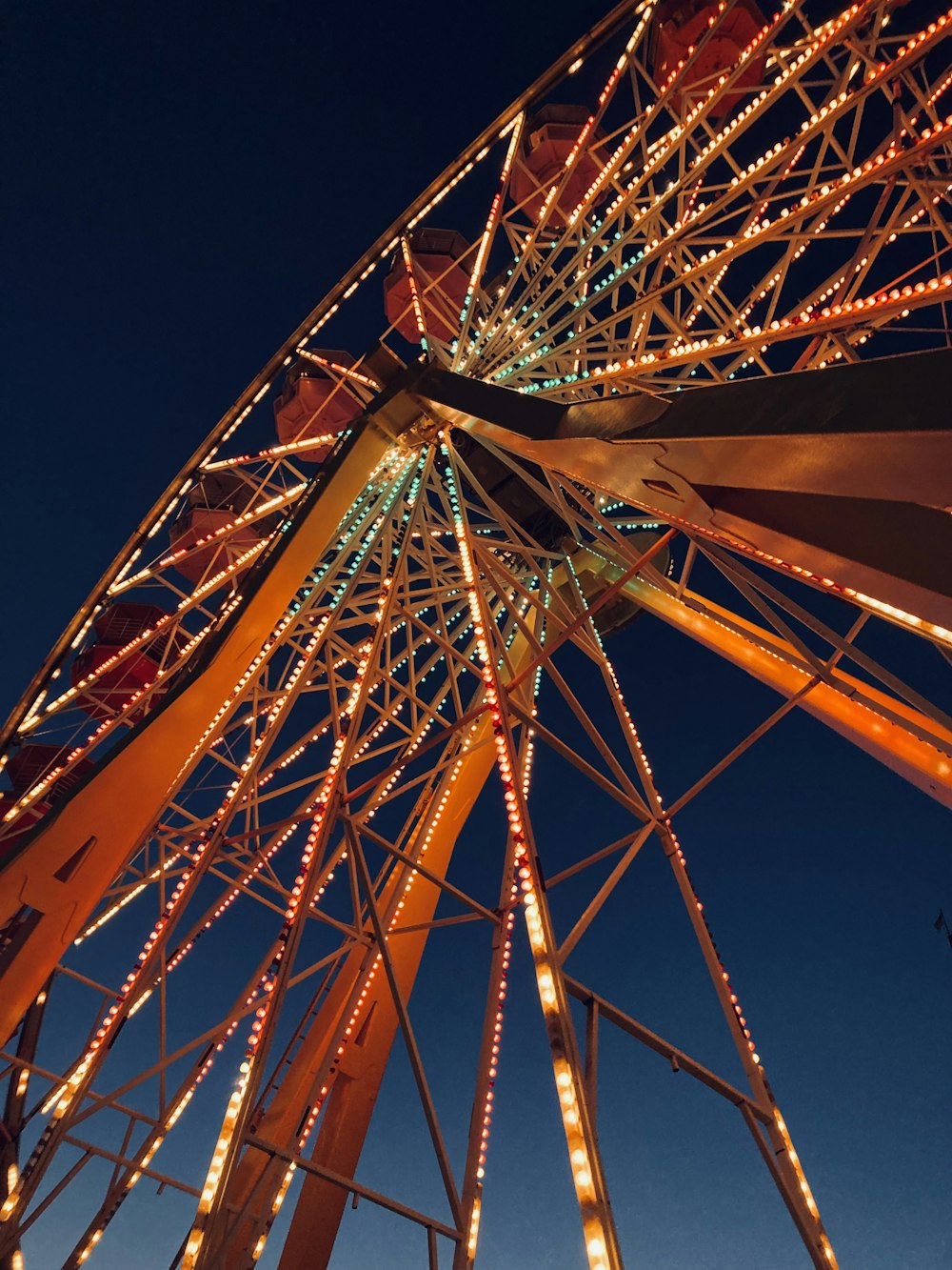 a ferris wheel lit up with christmas lights