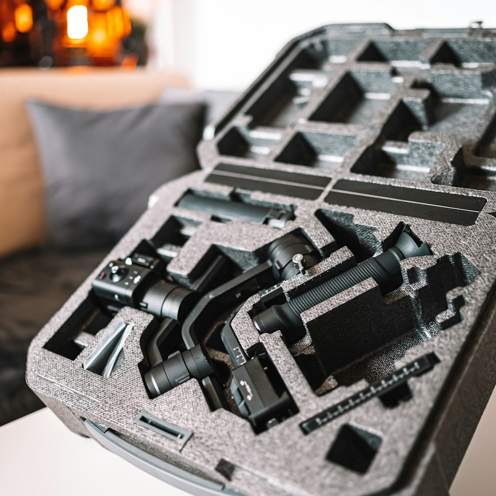 a close up of a tray of tools on a table