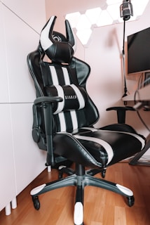 a black and white office chair sitting in a room
