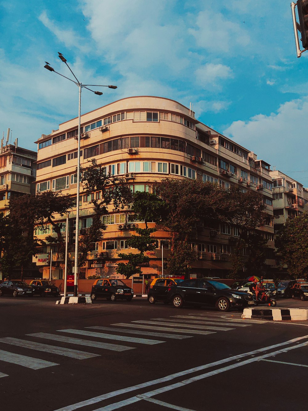 a very tall building sitting on the side of a road