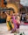Close-up of traditional dancers performing in vibrant costumes during a cultural event.
