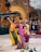Close-up of traditional dancers performing in vibrant costumes during a cultural event.