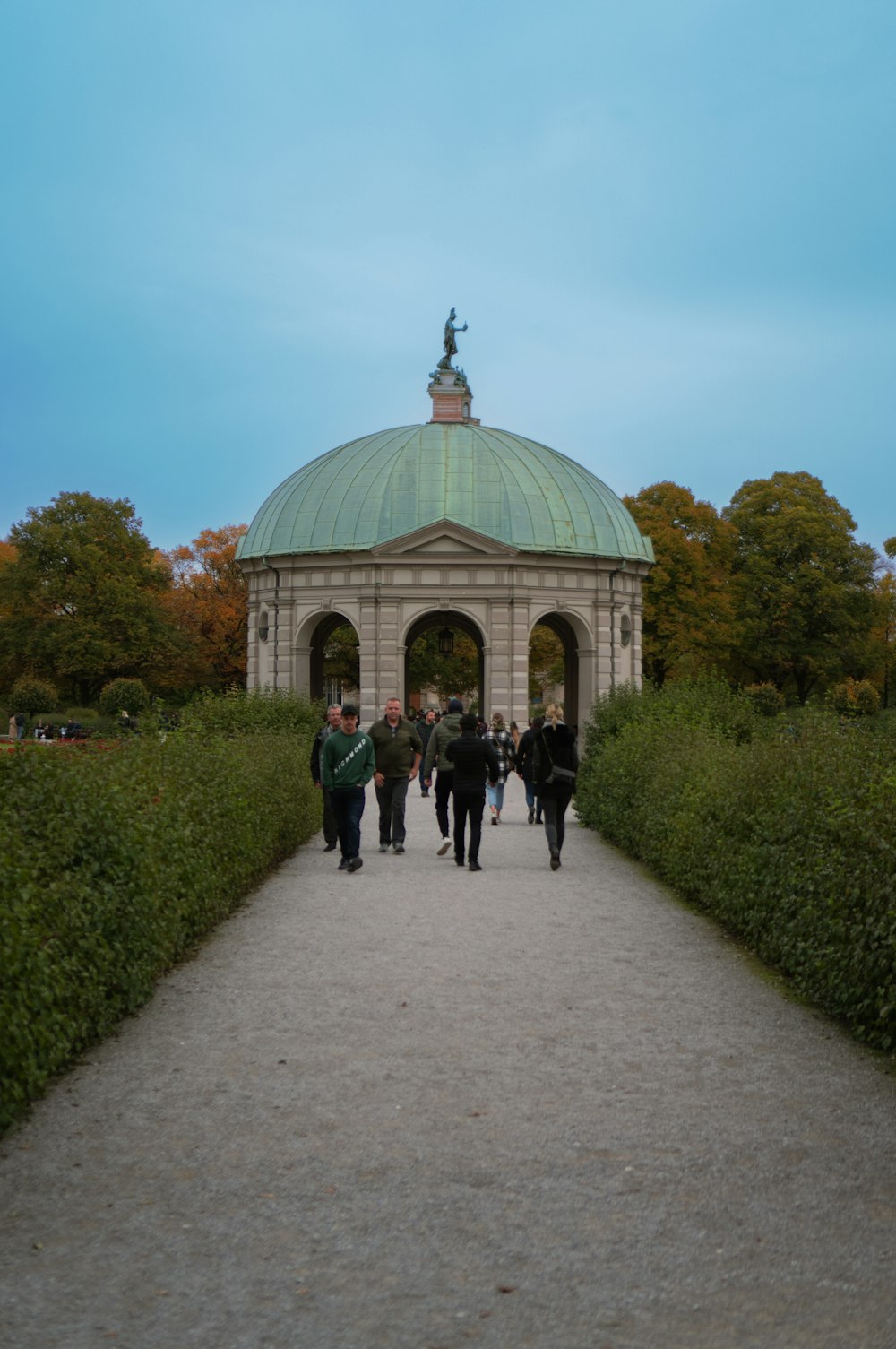 a group of people walking down a walkway