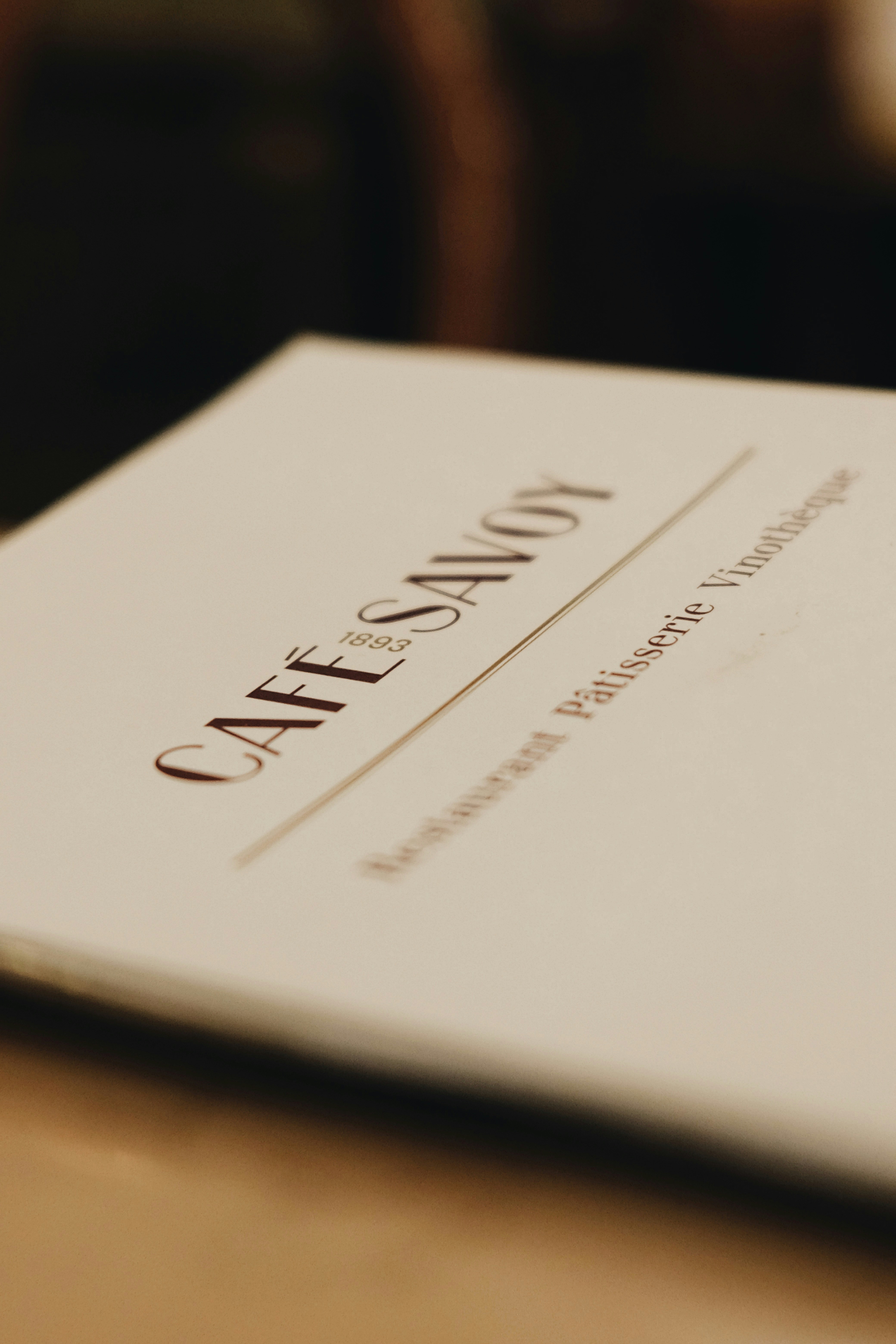 A close-up of a printed menu on a table.