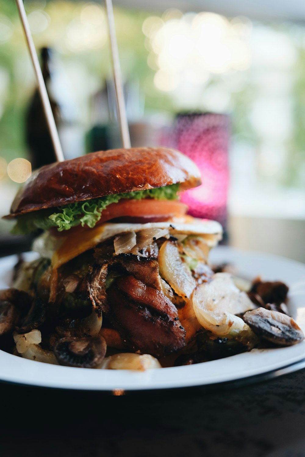 a plate with a sandwich and mushrooms on it