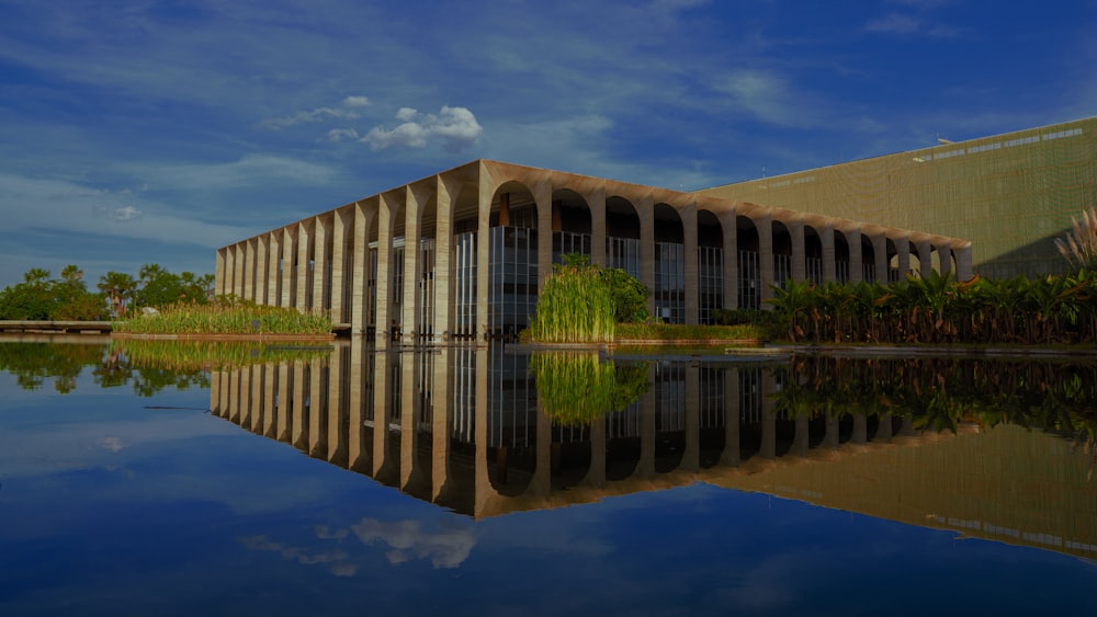 a large building sitting next to a body of water