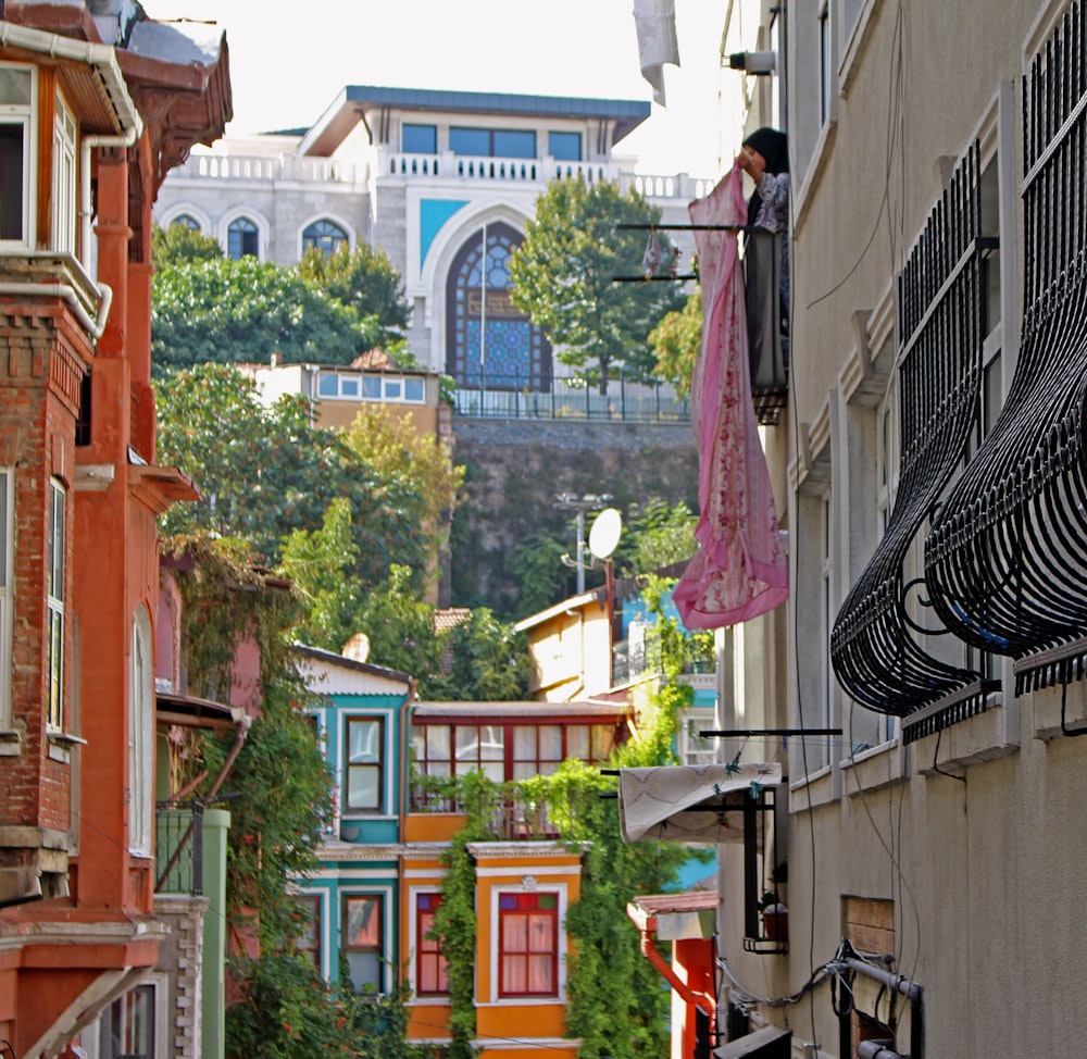 a view of a street with buildings and a bridge in the background