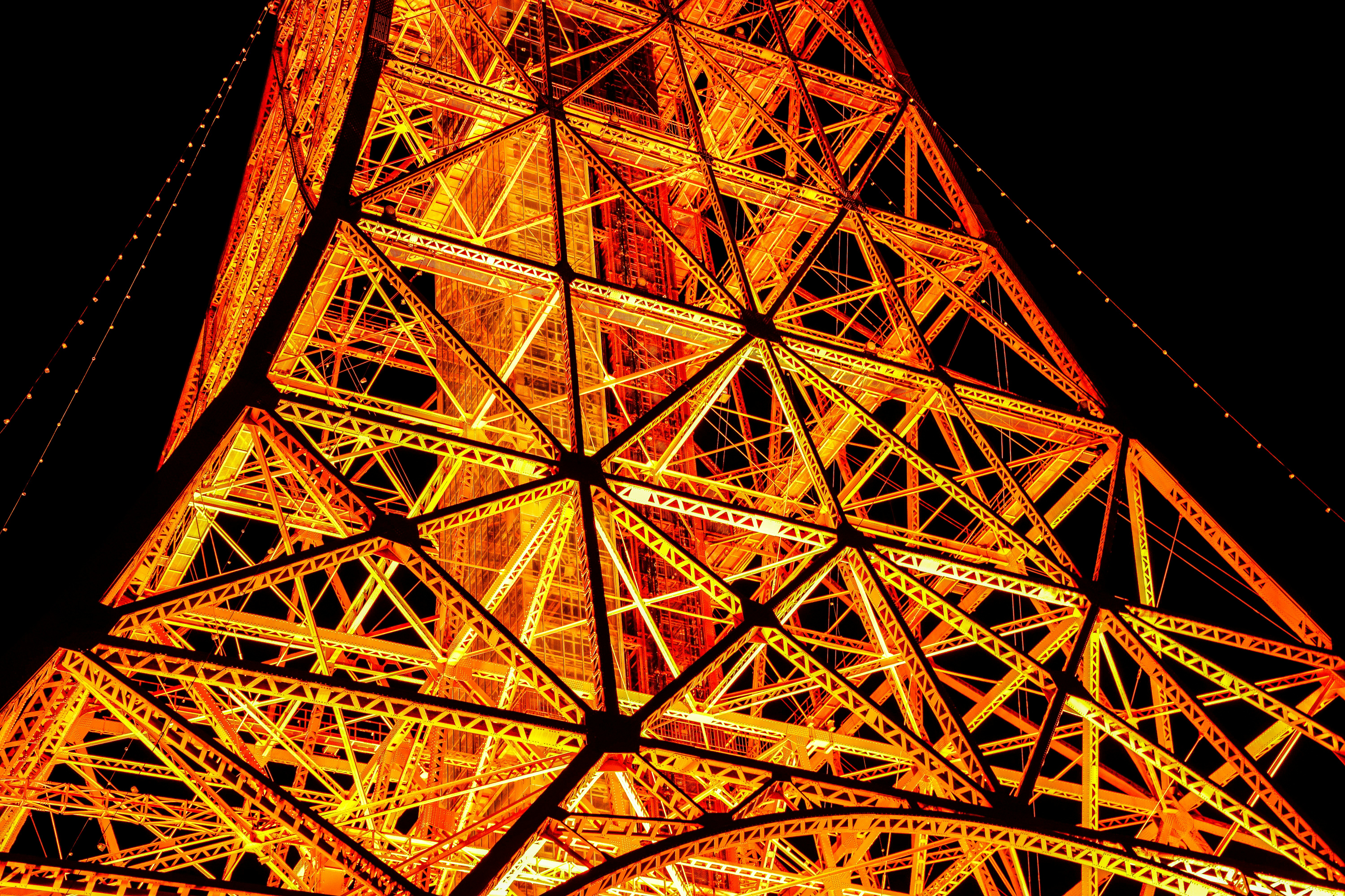 The top of the eiffel tower lit up at night photo – Free Japan Image on ...