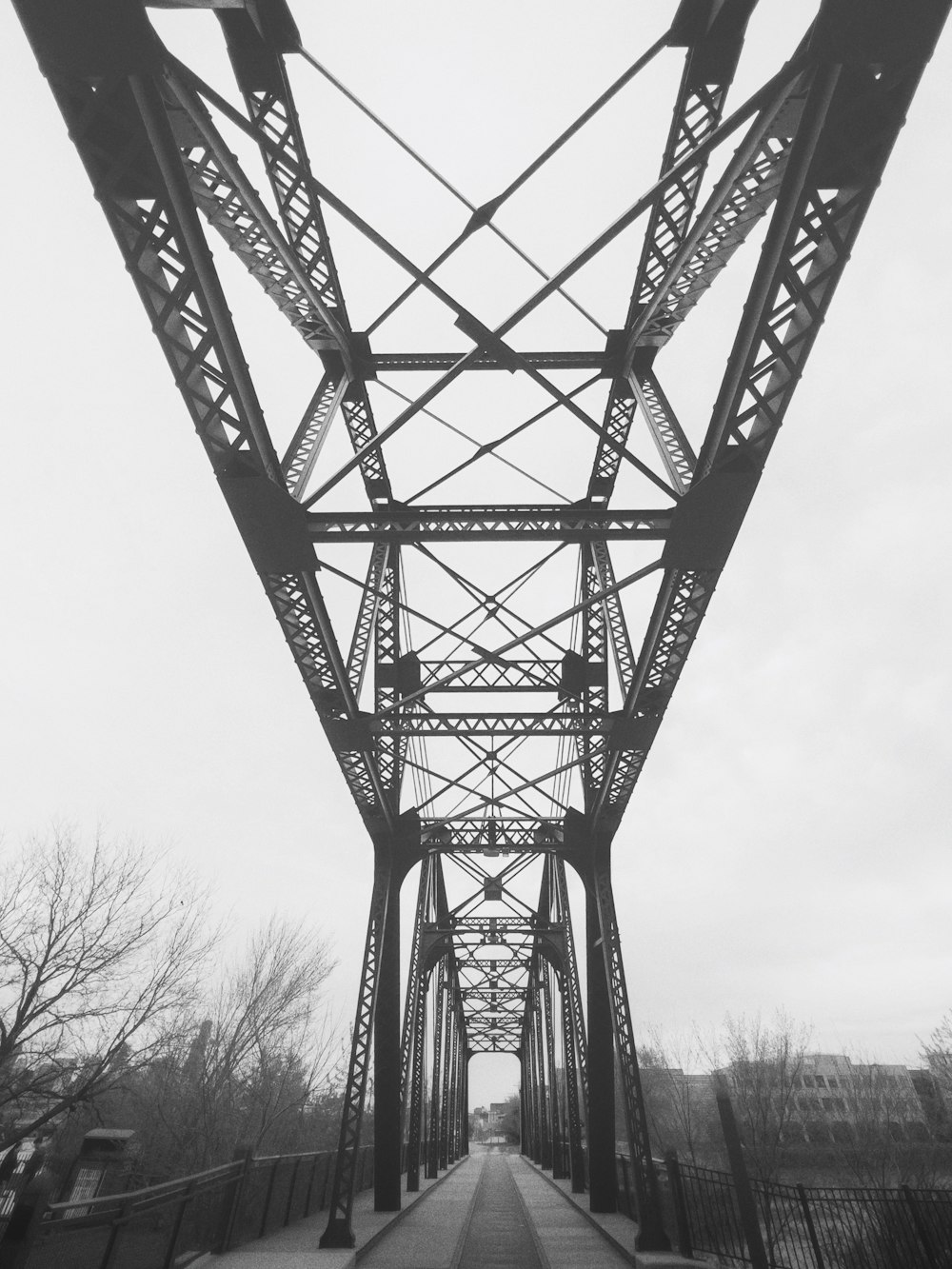 a black and white photo of a bridge