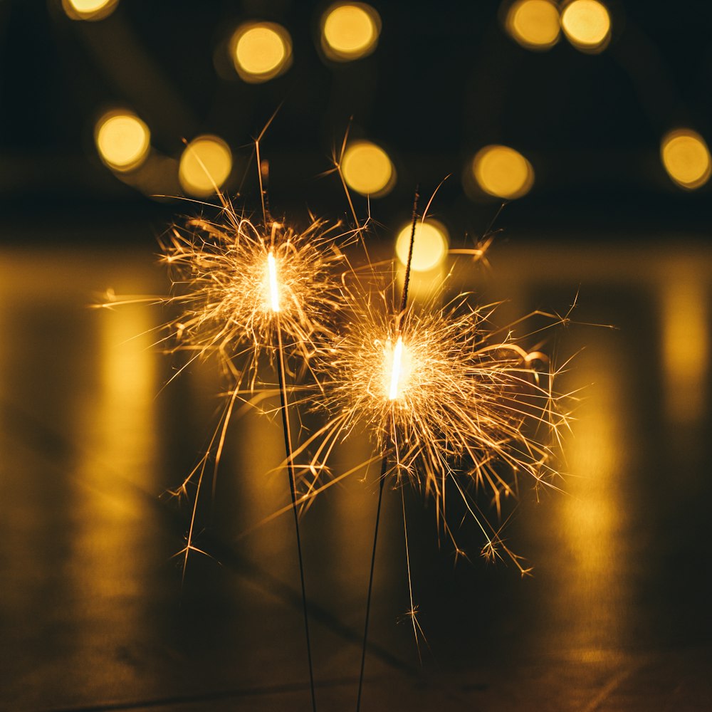 a couple of sparklers sitting on top of a table