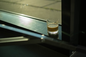 A peaceful morning scene with a glass of Clarexin cleanse drink beside a sunlit window.