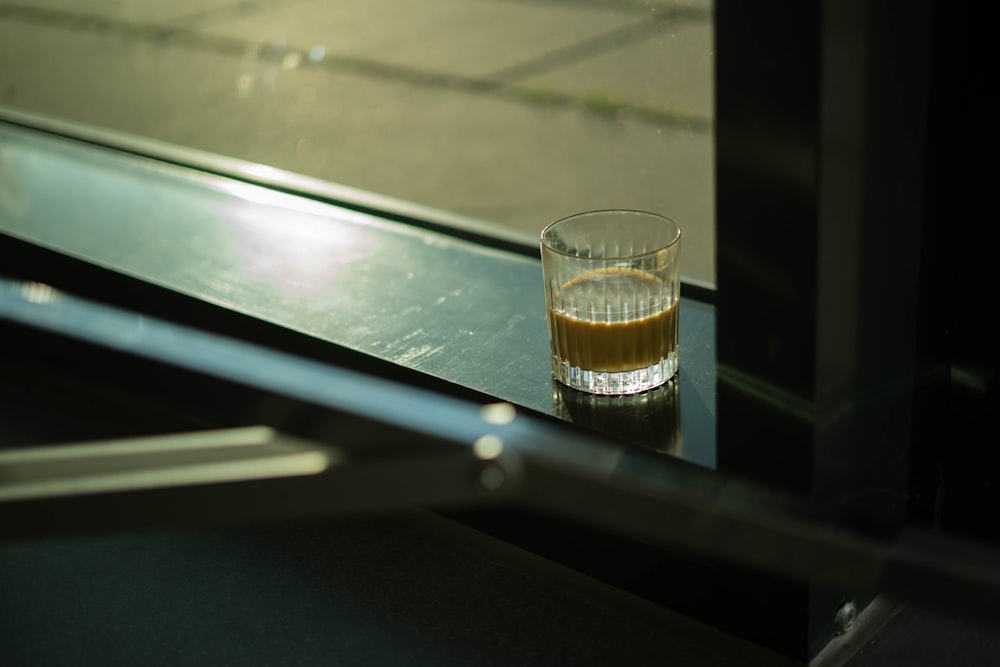 a shot glass sitting on top of a counter