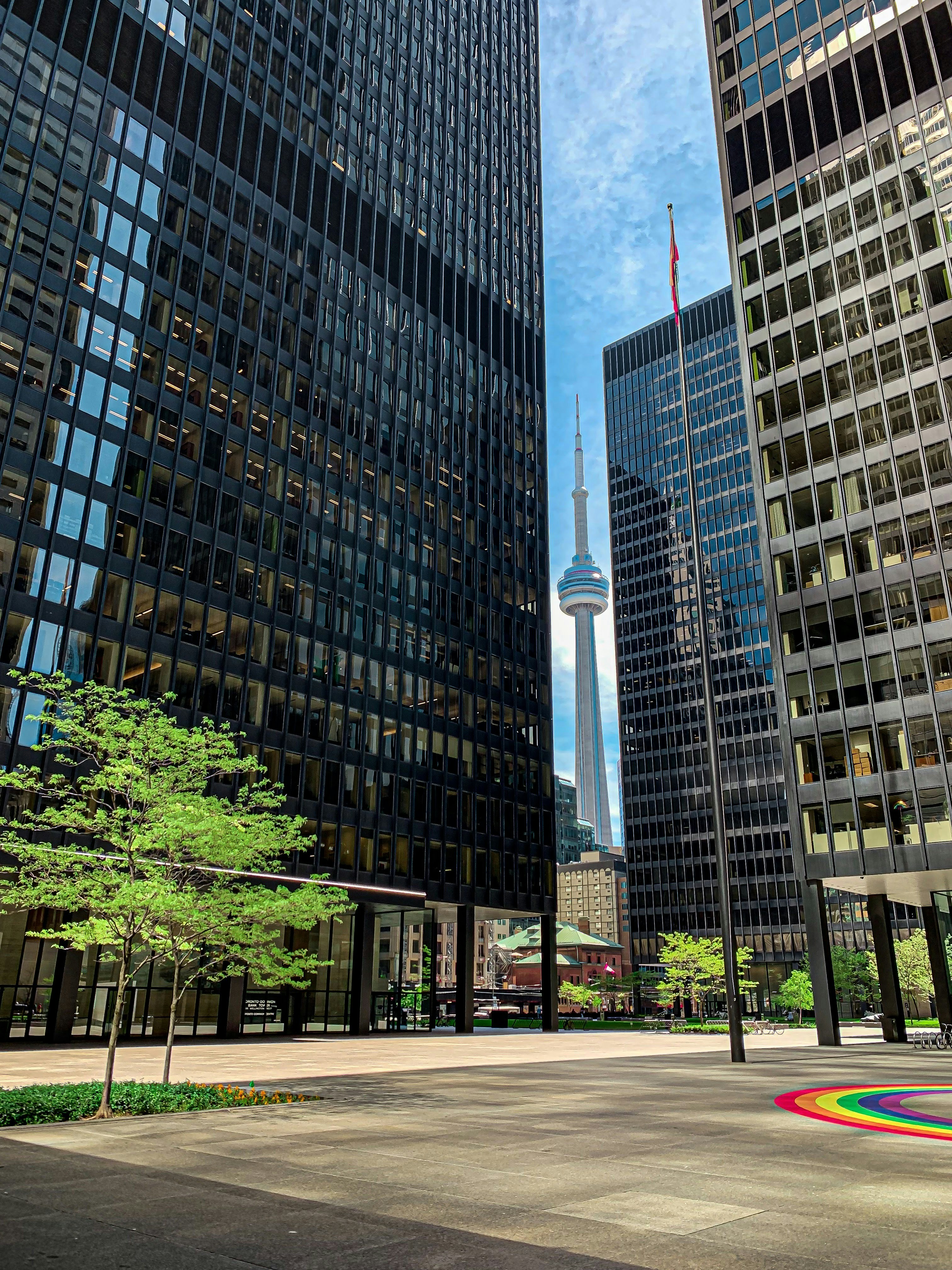 a couple of tall buildings sitting next to each other