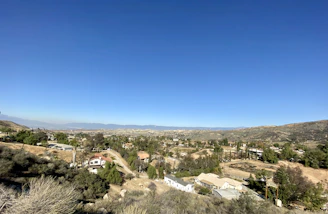 Panoramic view of Zacatecas hills with scattered houses and green patches