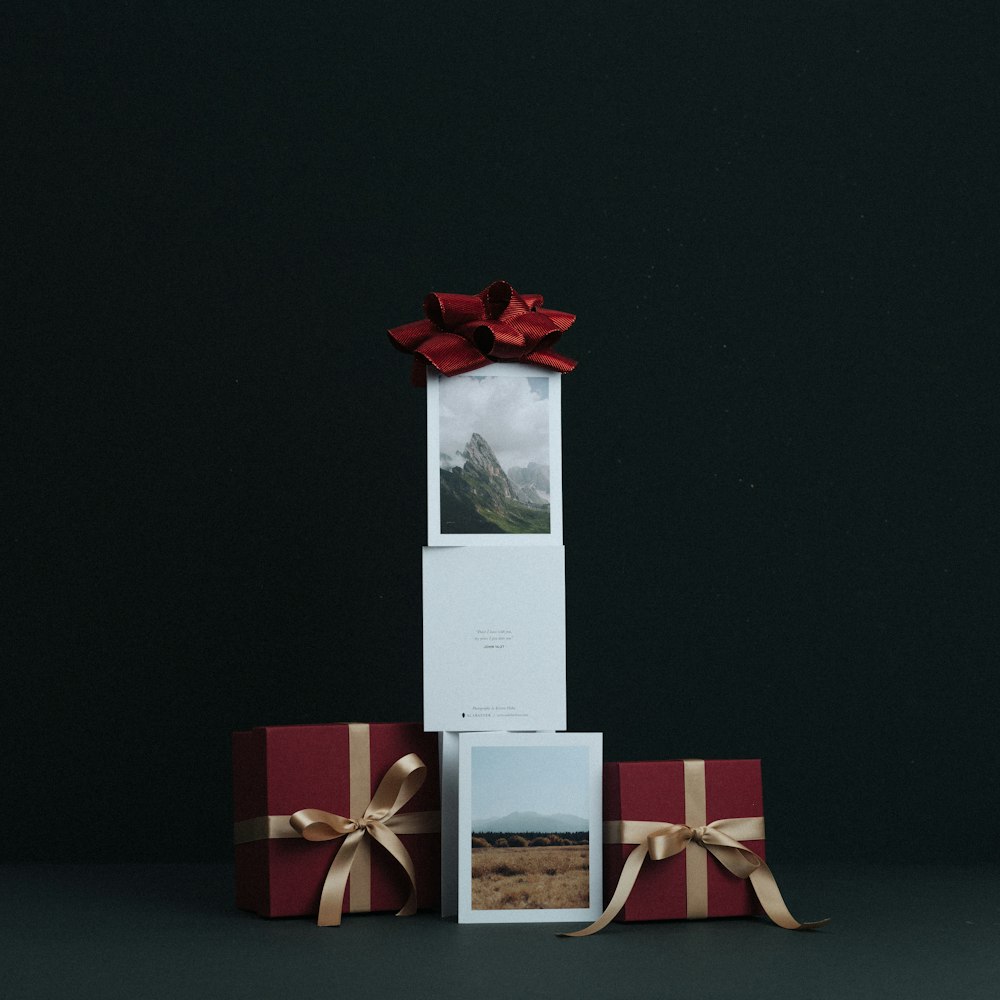a white box with a red bow on top of it