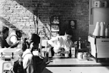 A barista preparing a signature Korean-inspired drink behind the cafe counter.