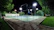 Photo of a newly finished backyard pickleball court glowing under soft evening lights with neat fencing.