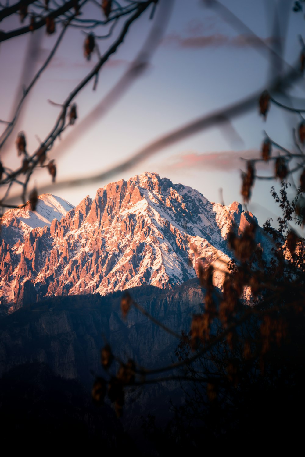 a view of a snow covered mountain from a distance