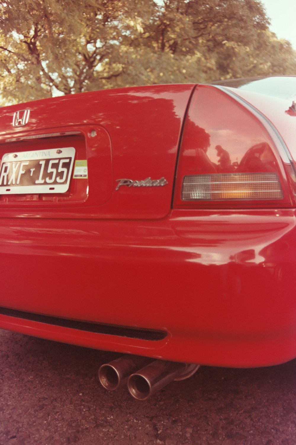 a red car parked on the side of the road