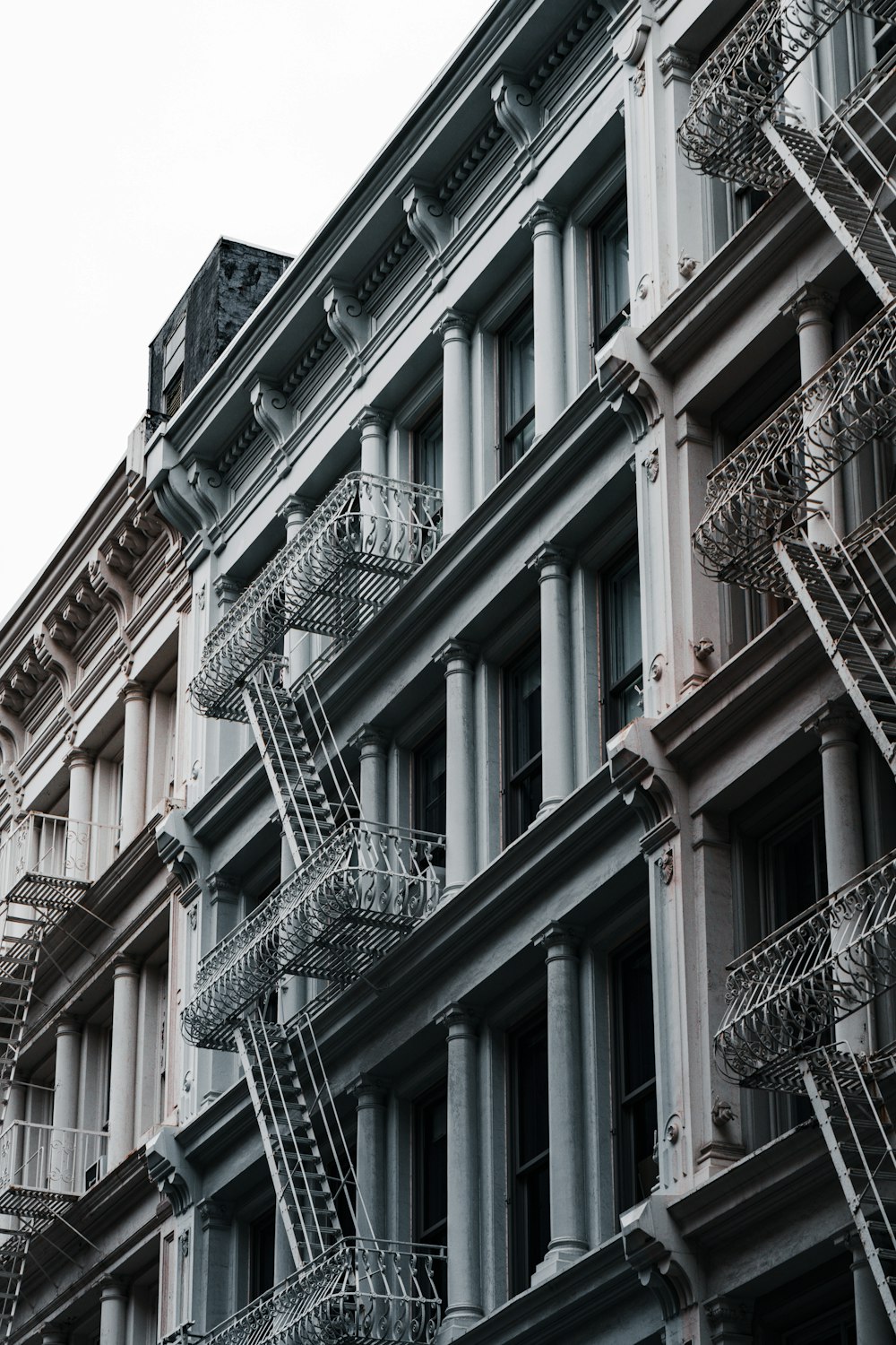 a building with a bunch of fire escapes on the side of it