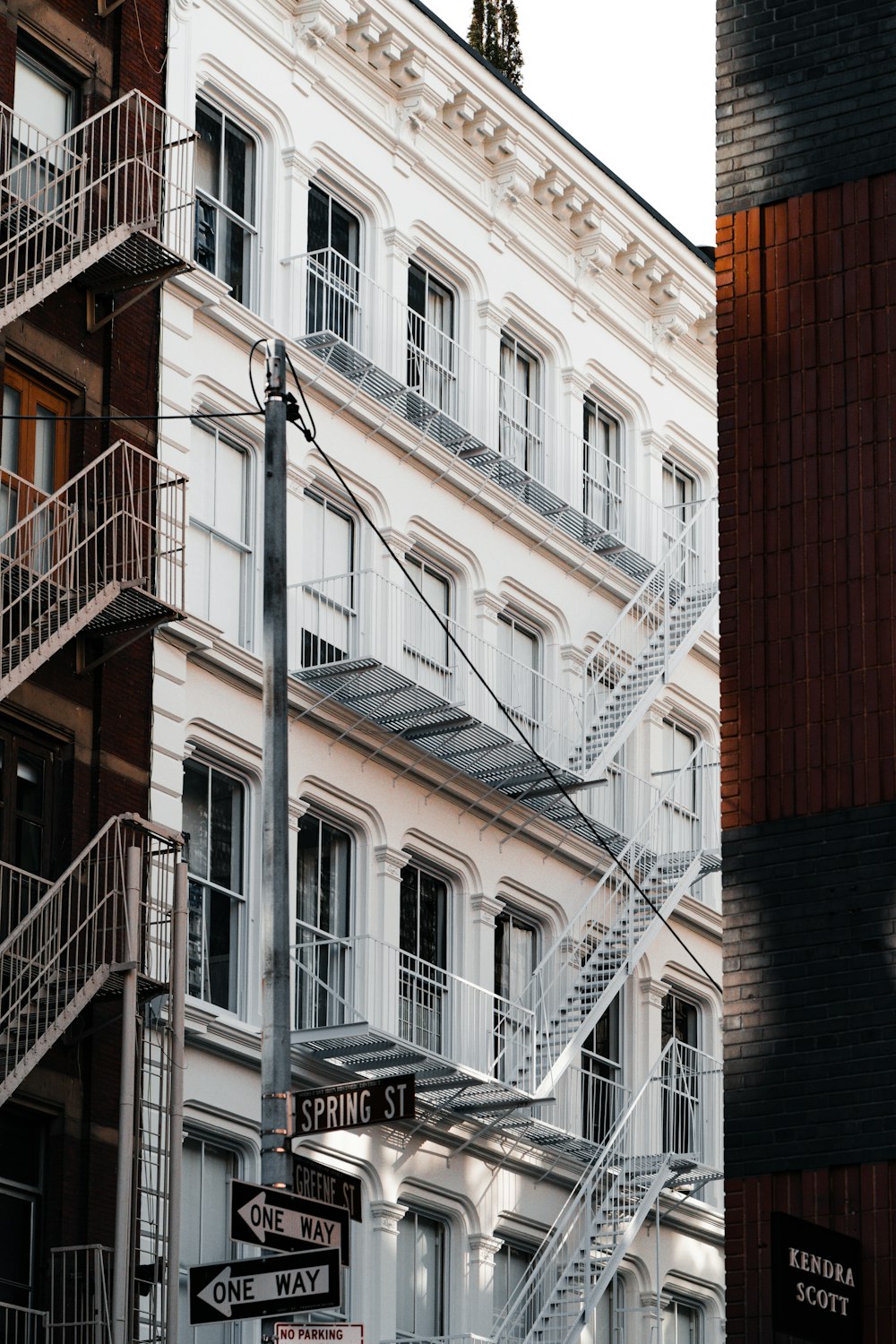 a street sign in front of a tall building