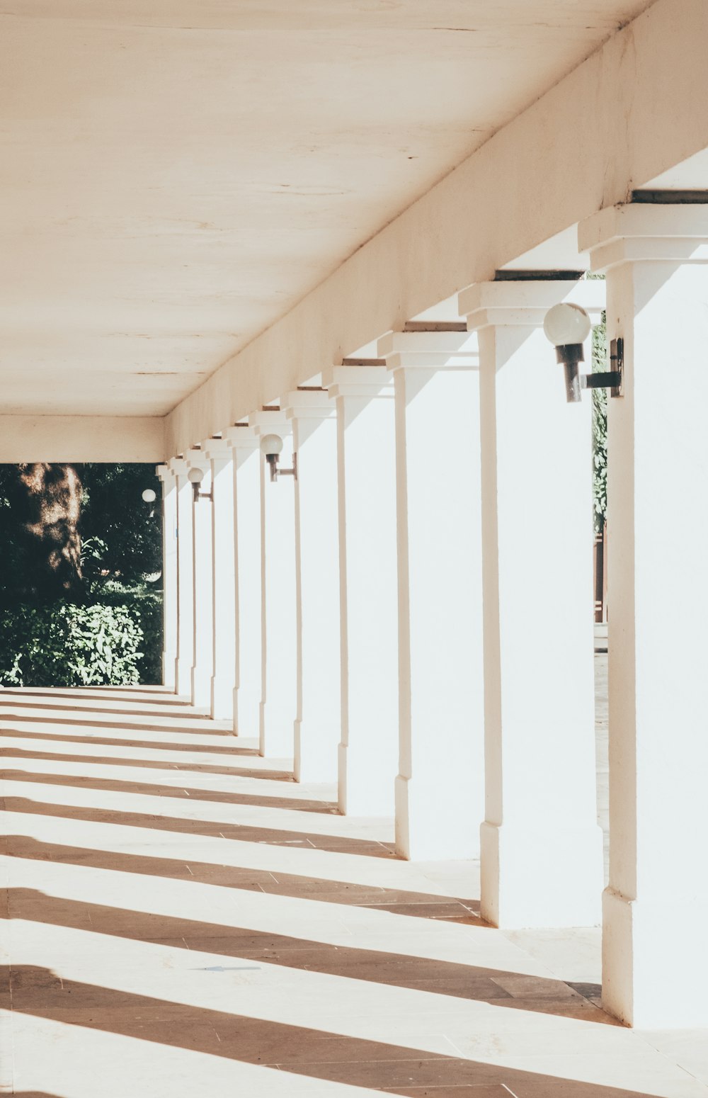 a long row of white pillars on a building