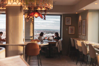 A cozy café setting where a couple shares their first smile.