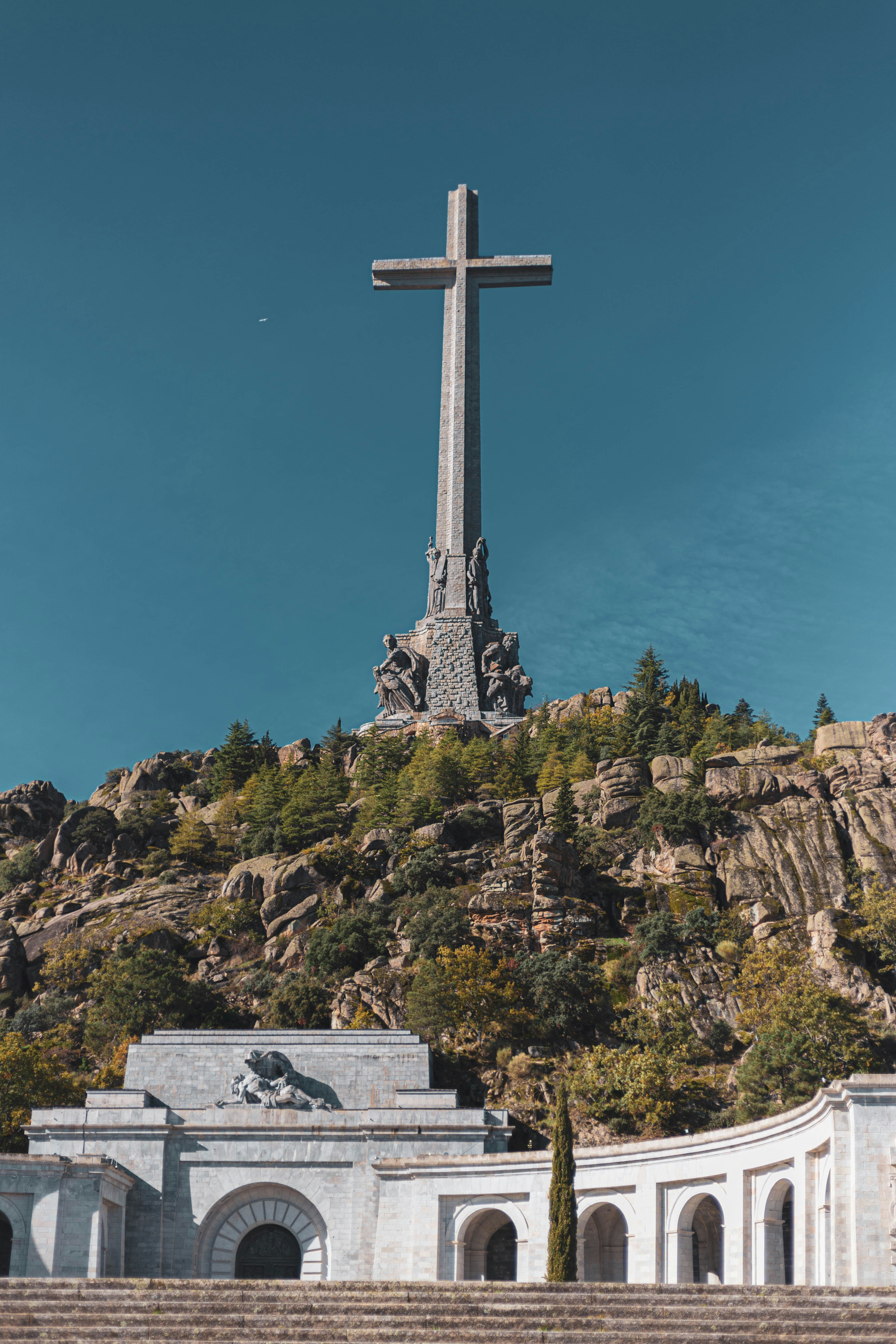 a large cross on top of a hill