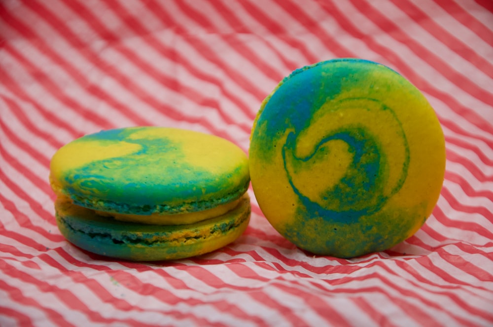 a close up of two macaroons on a table