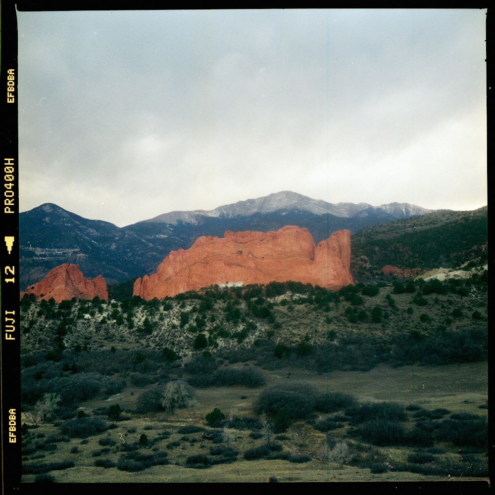 a view of a mountain range with mountains in the background