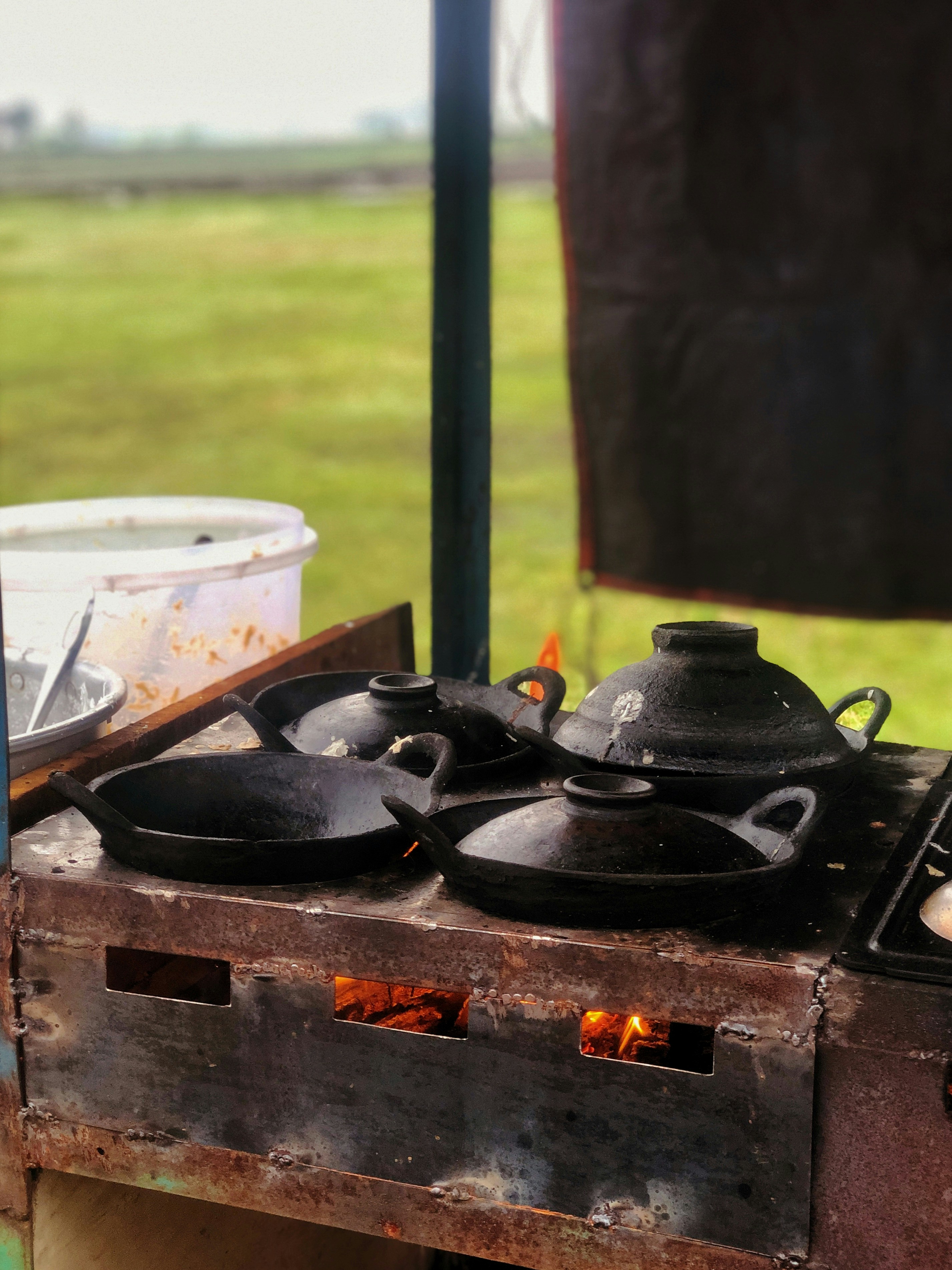 A grill with pots and pans cooking on it photo Free Indonesia Image